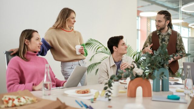 colleagues standing around in office