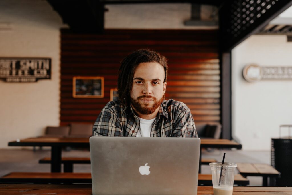 serious guy sitting at computer