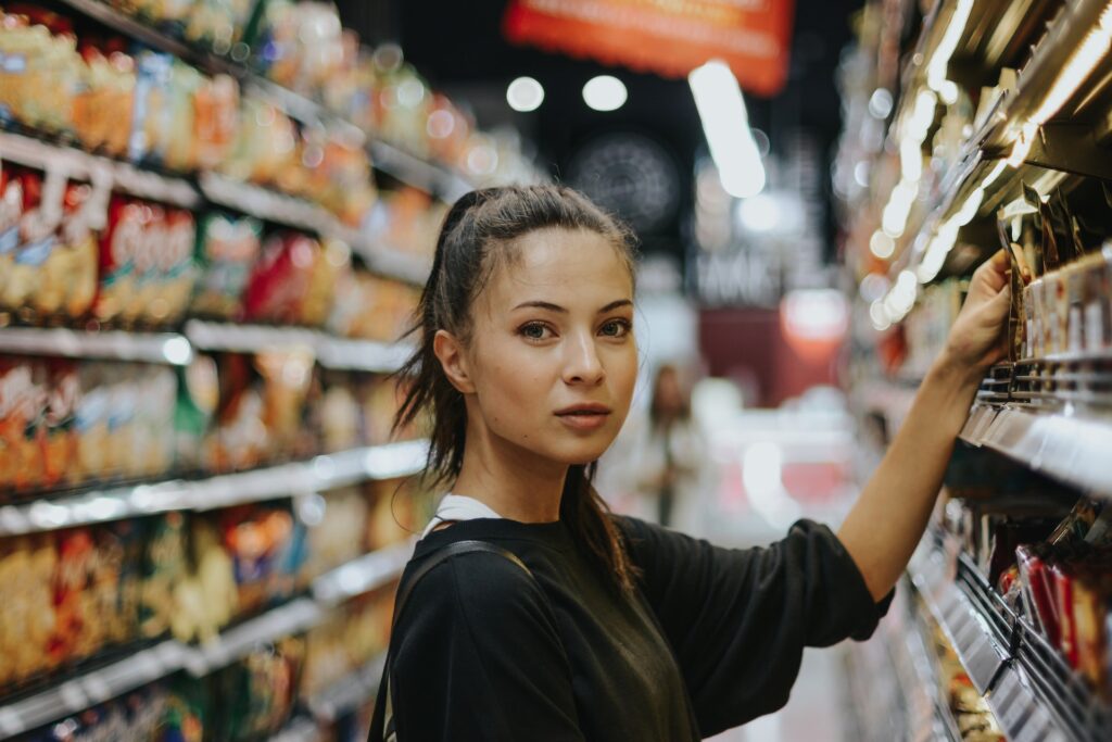 serious woman shopping at grocery store