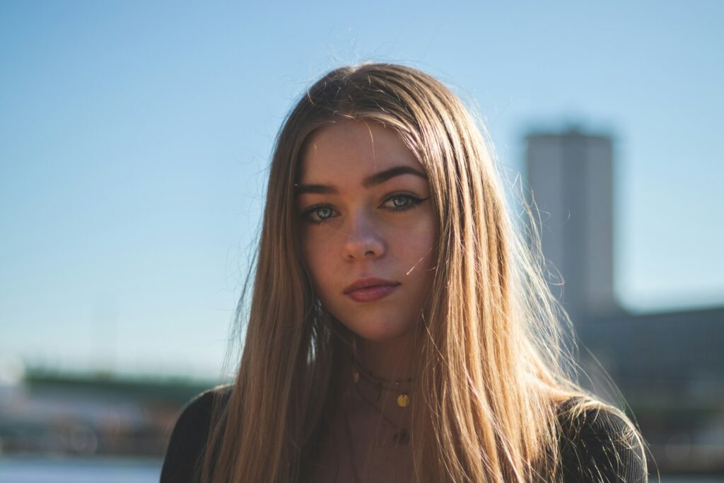 woman with long hair outside in sun