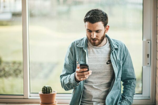 man texting on phone