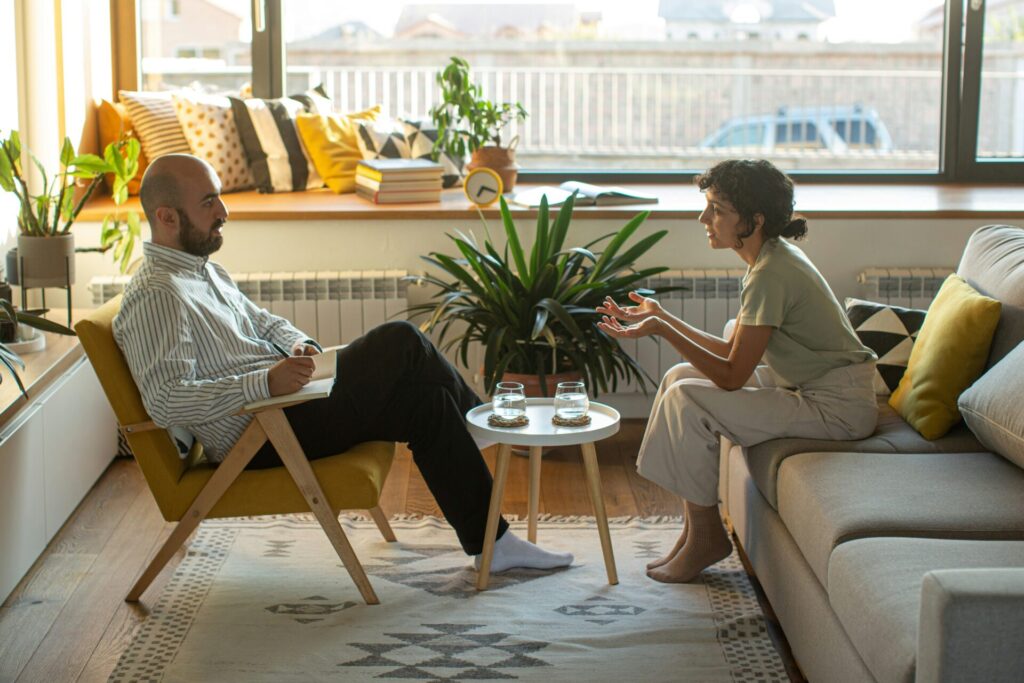 woman having therapy session with male therapist