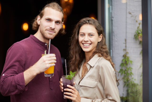 friendly woman and man smiling